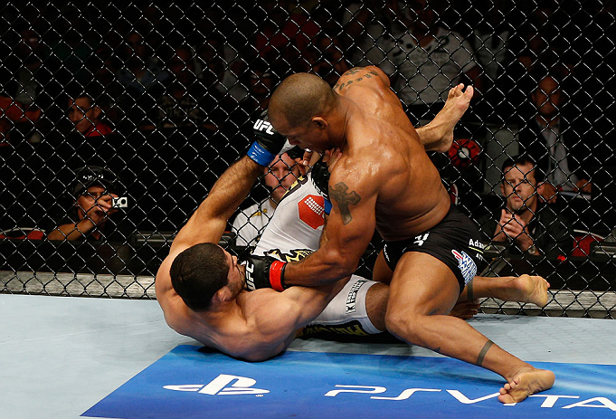GOLD COAST, AUSTRALIA - DECEMBER 15:  (R-L) Hector Lombard punches Rousimar Palhares during their middleweight fight at the UFC on FX event on December 15, 2012  at Gold Coast Convention and Exhibition Centre in Gold Coast, Australia.  (Photo by Josh Hedg