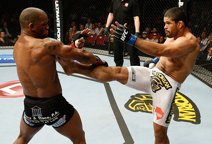 GOLD COAST, AUSTRALIA - DECEMBER 15:  (R-L) Rousimar Palhares kicks Hector Lombard during their middleweight fight at the UFC on FX event on December 15, 2012  at Gold Coast Convention and Exhibition Centre in Gold Coast, Australia.  (Photo by Josh Hedges