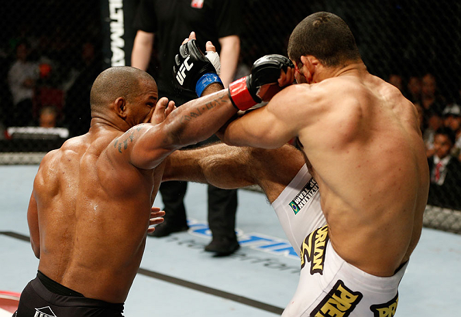 GOLD COAST, AUSTRALIA - DECEMBER 15:  (L-R) Hector Lombard punches Rousimar Palhares during their middleweight fight at the UFC on FX event on December 15, 2012  at Gold Coast Convention and Exhibition Centre in Gold Coast, Australia.  (Photo by Josh Hedg