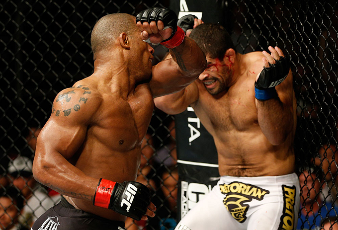 GOLD COAST, AUSTRALIA - DECEMBER 15:  (L-R) Hector Lombard punches Rousimar Palhares during their middleweight fight at the UFC on FX event on December 15, 2012  at Gold Coast Convention and Exhibition Centre in Gold Coast, Australia.  (Photo by Josh Hedg