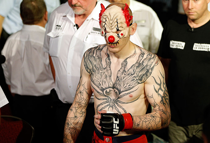 GOLD COAST, AUSTRALIA - DECEMBER 15:  Colin Fletcher enters the arena before his lightweight fight against Norman Parke at the UFC on FX event on December 15, 2012  at Gold Coast Convention and Exhibition Centre in Gold Coast, Australia.  (Photo by Josh H
