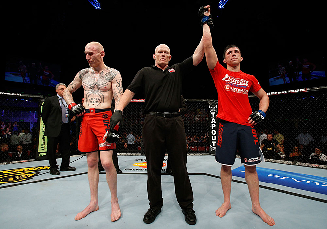 GOLD COAST, AUSTRALIA - DECEMBER 15:  Norman Parke (R) reacts after defeating Colin Fletcher during their lightweight fight at the UFC on FX event on December 15, 2012  at Gold Coast Convention and Exhibition Centre in Gold Coast, Australia.  (Photo by Jo