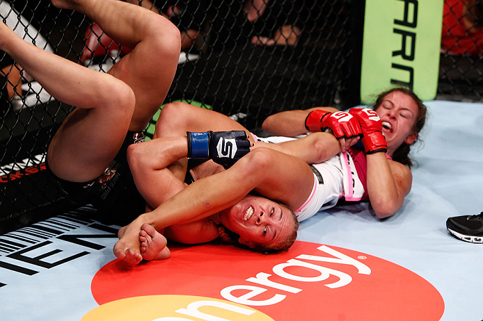 SAN DIEGO, CA - AUGUST 18:  (R-L) Miesha Tate secures an arm bar submission against Julie Kedzie during the Strikeforce event at Valley View Casino Center on August 18, 2012 in San Diego, California. (Photo by Esther Lin/Forza LLC/Forza LLC via Getty Imag