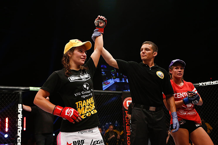 SAN DIEGO, CA - AUGUST 18:  Miesha Tate (L) reacts after defeating Julie Kedzie (R) during the Strikeforce event at Valley View Casino Center on August 18, 2012 in San Diego, California. (Photo by Esther Lin/Forza LLC/Forza LLC via Getty Images)