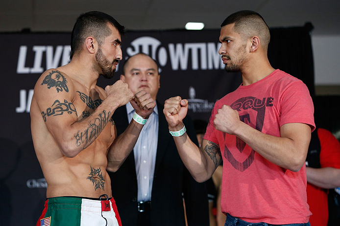 OKLAHOMA CITY, OK - JANUARY 11: (L-R) Opponents Estevan Payan and Michael Bravo face off during the Strikeforce weigh-in event on January 11, 2013 at Chesapeake Energy Arena in Oklahoma City, Oklahoma. (Photo by Esther Lin/Forza LLC/Forza LLC via Getty I
