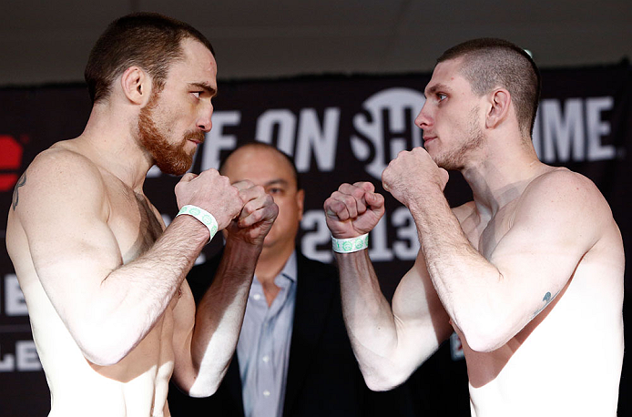 OKLAHOMA CITY, OK - JANUARY 11: (L-R) Opponents Pat Healy and Kurt Holobaugh face off during the Strikeforce weigh-in event on January 11, 2013 at Chesapeake Energy Arena in Oklahoma City, Oklahoma. (Photo by Esther Lin/Forza LLC/Forza LLC via Getty Imag