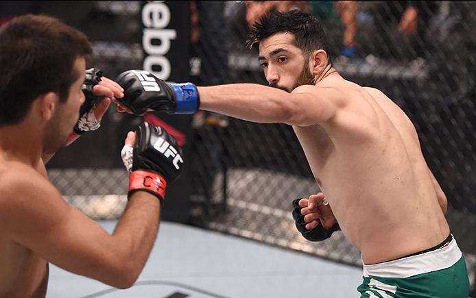 BUENOS AIRES, ARGENTINA - MAY 24: (R-L) John Bedoya punches Walter Zamora during the filming of The Ultimate Fighter Latin America: Team Liddell vs Team Griffin on May 24, 2016 in Buenos Aires, Argentina. (Photo by Amilcar Orfali/Zuffa LLC/Zuffa LLC via