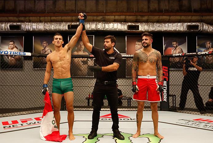 BUENOS AIRES, ARGENTINA - MAY 20: (L-R) Claudio Puelles celebrates his victory over Jose David Flores during the filming of The Ultimate Fighter Latin America: Team Liddell vs Team Griffin on May 20, 2016 in Buenos Aires, Argentina. (Photo by Gabriel Ros