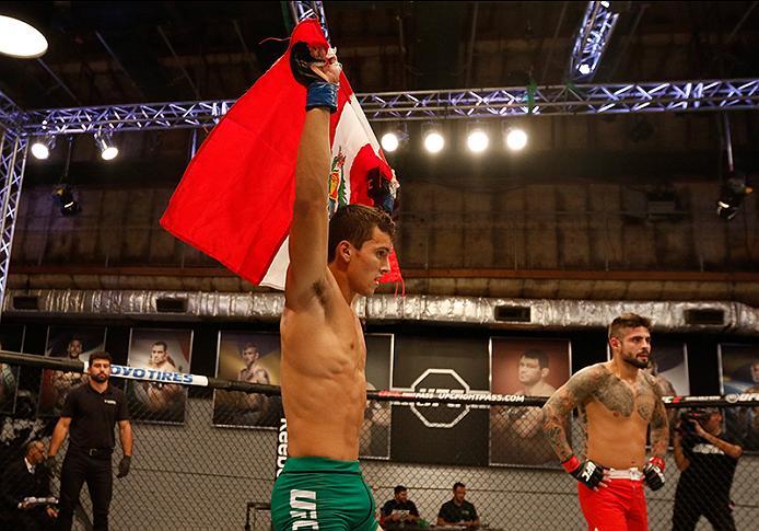 BUENOS AIRES, ARGENTINA - MAY 20: (L-R) Claudio Puelles celebrates his victory over Jose David Flores during the filming of The Ultimate Fighter Latin America: Team Liddell vs Team Griffin on May 20, 2016 in Buenos Aires, Argentina. (Photo by Gabriel Ros