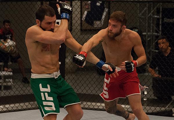 LAS VEGAS, NV - APRIL 3: (R-L) Kevin Mendinilla punches Enrique Marin during the filming of The Ultimate Fighter Latin America: Team Gastelum vs Team Escudero on April 3, 2015 in Las Vegas, Nevada. (Photo by Brandon Magnus/Zuffa LLC/Zuffa LLC via Getty