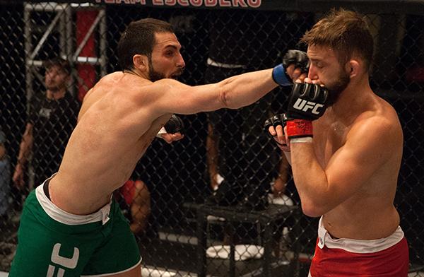 LAS VEGAS, NV - APRIL 3: (L-R) Enrique Marin punches Kevin Mendinilla during the filming of The Ultimate Fighter Latin America: Team Gastelum vs Team Escudero on April 3, 2015 in Las Vegas, Nevada. (Photo by Brandon Magnus/Zuffa LLC/Zuffa LLC via Getty