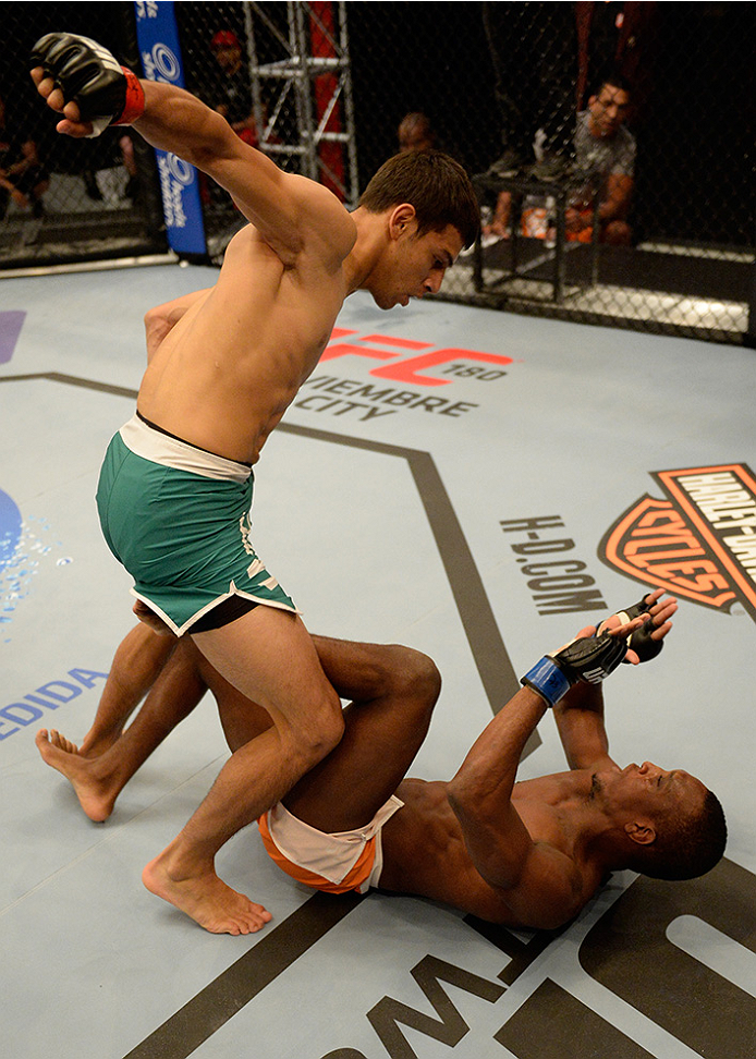 LAS VEGAS, NV - MAY 30: (L-R) Team Velasquez fighter Yair Rodriguez punches team Werdum fighter Humberto Brown in their preliminary fight during filming of The Ultimate Fighter Latin America on May 30, 2014 in Las Vegas, Nevada. (Photo by Jeff Bottari/Zu