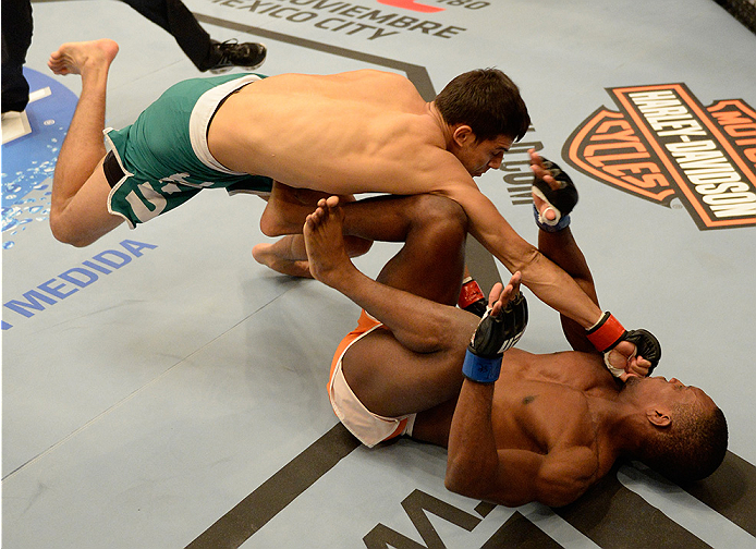 LAS VEGAS, NV - MAY 30: (L-R) Team Velasquez fighter Yair Rodriguez punches team Werdum fighter Humberto Brown in their preliminary fight during filming of The Ultimate Fighter Latin America on May 30, 2014 in Las Vegas, Nevada. (Photo by Jeff Bottari/Zu