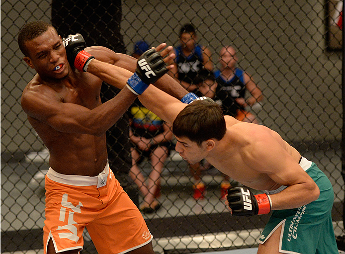 LAS VEGAS, NV - MAY 30: (R-L) Team Velasquez fighter Yair Rodriguez punches team Werdum fighter Humberto Brown in their preliminary fight during filming of The Ultimate Fighter Latin America on May 30, 2014 in Las Vegas, Nevada. (Photo by Jeff Bottari/Zu