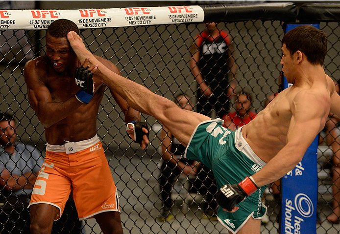 LAS VEGAS, NV - MAY 30: (R-L) Team Velasquez fighter Yair Rodriguez kicks team Werdum fighter Humberto Brown in their preliminary fight during filming of The Ultimate Fighter Latin America on May 30, 2014 in Las Vegas, Nevada. (Photo by Jeff Bottari/Zuff