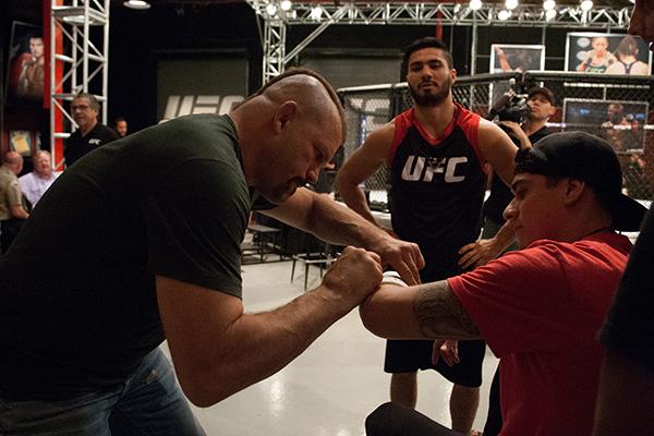 LAS VEGAS, NV - APRIL 14:  UFC Hall of Famer Chuck Liddell signs the cast of a fighter fight during the filming of The Ultimate Fighter Latin America: Team Gastelum vs Team Escudero  on April 14, 2015 in Las Vegas, Nevada. (Photo by Brandon Magnus/Zuffa L