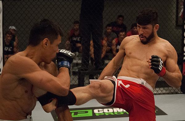 LAS VEGAS, NV - APRIL 14: (R-L) Polo Reyes kicks Christhian Soto during the filming of The Ultimate Fighter Latin America: Team Gastelum vs Team Escudero on April 14, 2015 in Las Vegas, Nevada. (Photo by Brandon Magnus/Zuffa LLC/Zuffa LLC via Getty Imag
