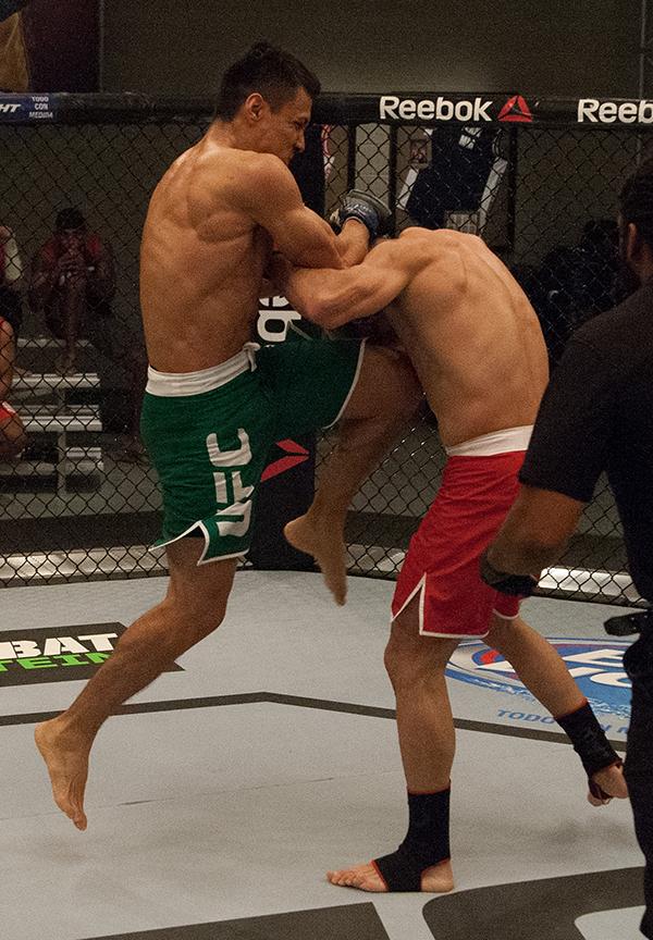 LAS VEGAS, NV - APRIL 14:  (L-R) Christhian Soto knees Polo Reyes during the filming of The Ultimate Fighter Latin America: Team Gastelum vs Team Escudero  on April 14, 2015 in Las Vegas, Nevada. (Photo by Brandon Magnus/Zuffa LLC/Zuffa LLC via Getty Imag