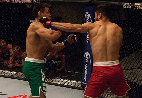 LAS VEGAS, NV - APRIL 14:  (R-L) Polo Reyes punches Christhian Soto during the filming of The Ultimate Fighter Latin America: Team Gastelum vs Team Escudero  on April 14, 2015 in Las Vegas, Nevada. (Photo by Brandon Magnus/Zuffa LLC/Zuffa LLC via Getty Im