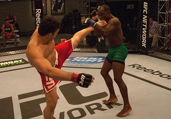 LAS VEGAS, NV - APRIL 14: (L-R) Vernon Ramos kicks Wilmer Fernandez during the filming of The Ultimate Fighter Latin America: Team Gastelum vs Team Escudero on April 14, 2015 in Las Vegas, Nevada. (Photo by Brandon Magnus/Zuffa LLC/Zuffa LLC via Getty I