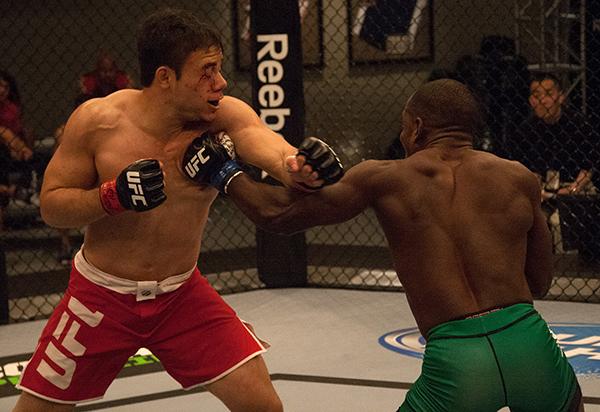 LAS VEGAS, NV - APRIL 14: (R-L) Wilmer Fernandez punches Vernon Ramos during the filming of The Ultimate Fighter Latin America: Team Gastelum vs Team Escudero on April 14, 2015 in Las Vegas, Nevada. (Photo by Brandon Magnus/Zuffa LLC/Zuffa LLC via Getty