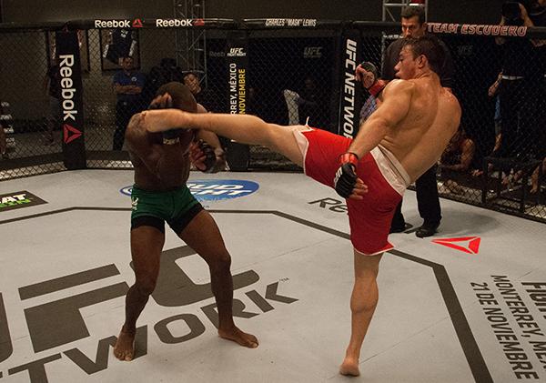 LAS VEGAS, NV - APRIL 14: (R-L) Vernon Ramos kicks Wilmer Fernandez during the filming of The Ultimate Fighter Latin America: Team Gastelum vs Team Escudero on April 14, 2015 in Las Vegas, Nevada. (Photo by Brandon Magnus/Zuffa LLC/Zuffa LLC via Getty I