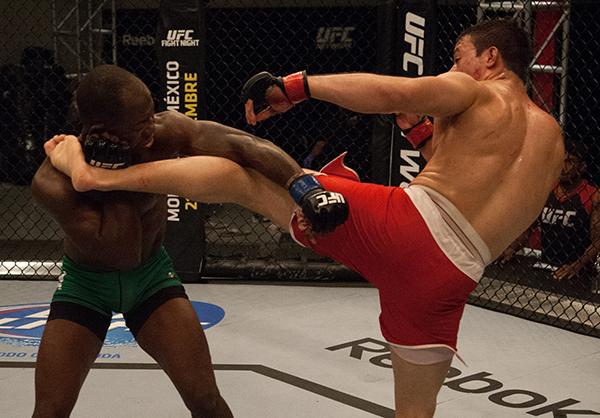 LAS VEGAS, NV - APRIL 14: (R-L) Vernon Ramos kicks Wilmer Fernandez during the filming of The Ultimate Fighter Latin America: Team Gastelum vs Team Escudero on April 14, 2015 in Las Vegas, Nevada. (Photo by Brandon Magnus/Zuffa LLC/Zuffa LLC via Getty I