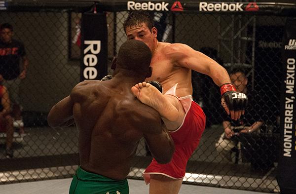 LAS VEGAS, NV - APRIL 14: (R-L) Vernon Ramos kicks Wilmer Fernandez during the filming of The Ultimate Fighter Latin America: Team Gastelum vs Team Escudero on April 14, 2015 in Las Vegas, Nevada. (Photo by Brandon Magnus/Zuffa LLC/Zuffa LLC via Getty I