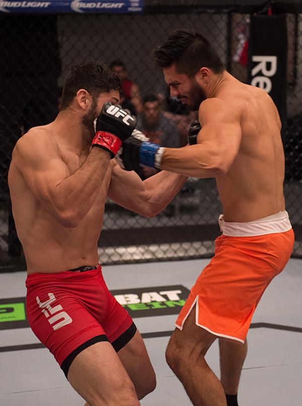 LAS VEGAS, NV - APRIL 21: (R-L) Horacio Gutrierrez punches Polo Reyes in their semi-finals fight during the filming of The Ultimate Fighter Latin America: Team Gastelum vs Team Escudero on April 21, 2015 in Las Vegas, Nevada. (Photo by Brandon Magnus/Zuf