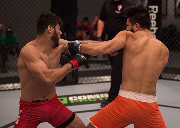 LAS VEGAS, NV - APRIL 21: (R-L) Horacio Gutrierrez punches Polo Reyes in their semi-finals fight during the filming of The Ultimate Fighter Latin America: Team Gastelum vs Team Escudero on April 21, 2015 in Las Vegas, Nevada. (Photo by Brandon Magnus/Zuf