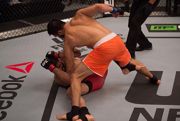 LAS VEGAS, NV - APRIL 21: Horacio Gutrierrez (top) punches Polo Reyes in their semi-finals fight during the filming of The Ultimate Fighter Latin America: Team Gastelum vs Team Escudero on April 21, 2015 in Las Vegas, Nevada. (Photo by Brandon Magnus/Zuf