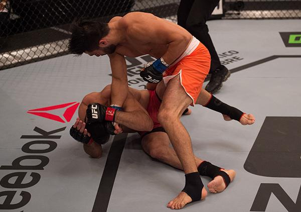 LAS VEGAS, NV - APRIL 21: Horacio Gutrierrez (top) punches Polo Reyes in their semi-finals fight during the filming of The Ultimate Fighter Latin America: Team Gastelum vs Team Escudero on April 21, 2015 in Las Vegas, Nevada. (Photo by Brandon Magnus/Zuf