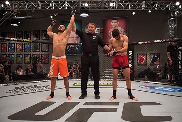 LAS VEGAS, NV - APRIL 21: (L-R) Horacio Gutrierrez celebrates his victory over Polo Reyes in their semi-finals fight during the filming of The Ultimate Fighter Latin America: Team Gastelum vs Team Escudero on April 21, 2015 in Las Vegas, Nevada. (Photo b