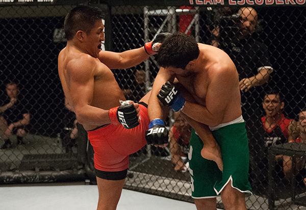 LAS VEGAS, NV - APRIL 7: (L-R) Enrique Barzola knees Jonathan Ortega during the filming of The Ultimate Fighter Latin America: Team Gastelum vs Team Escudero on April 7, 2015 in Las Vegas, Nevada. (Photo by Brandon Magnus/Zuffa LLC/Zuffa LLC via Getty I