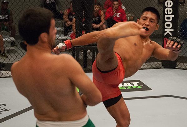 LAS VEGAS, NV - APRIL 7: (R-L) Enrique Barzola kicks Jonathan Ortega during the filming of The Ultimate Fighter Latin America: Team Gastelum vs Team Escudero on April 7, 2015 in Las Vegas, Nevada. (Photo by Brandon Magnus/Zuffa LLC/Zuffa LLC via Getty I