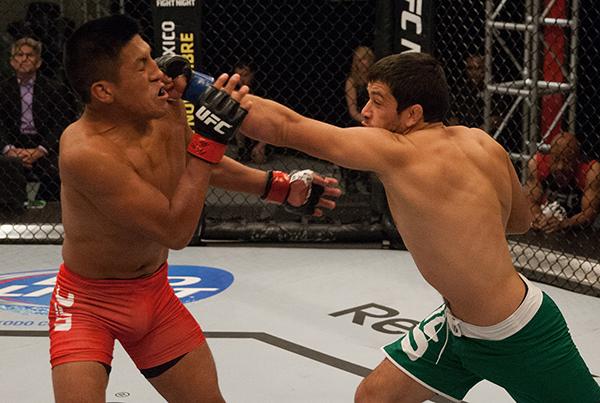 LAS VEGAS, NV - APRIL 7: (R-L) Jonathan Ortega punches Enrique Barzola during the filming of The Ultimate Fighter Latin America: Team Gastelum vs Team Escudero on April 7, 2015 in Las Vegas, Nevada. (Photo by Brandon Magnus/Zuffa LLC/Zuffa LLC via Getty