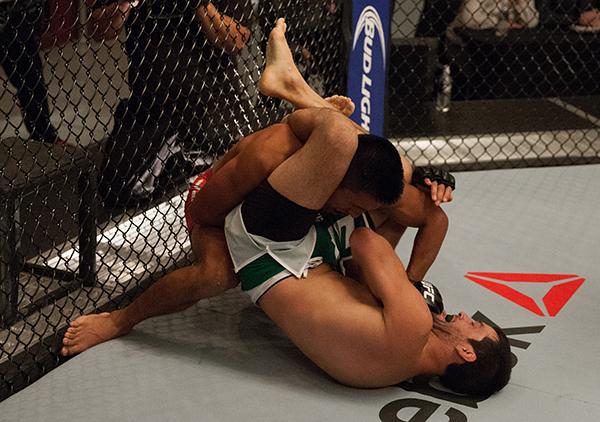 LAS VEGAS, NV - APRIL 7: Enrique Barzola (top) punches Jonathan Ortega during the filming of The Ultimate Fighter Latin America: Team Gastelum vs Team Escudero on April 7, 2015 in Las Vegas, Nevada. (Photo by Brandon Magnus/Zuffa LLC/Zuffa LLC via Getty