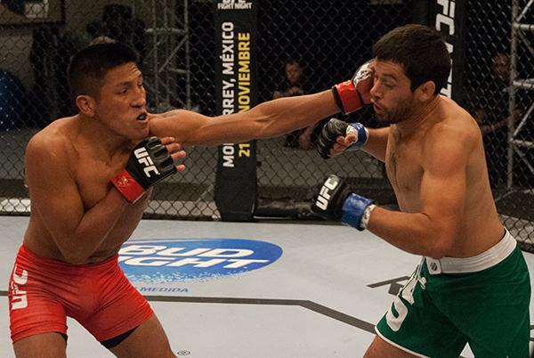 LAS VEGAS, NV - APRIL 7: (L-R) Enrique Barzola punches Jonathan Ortega during the filming of The Ultimate Fighter Latin America: Team Gastelum vs Team Escudero on April 7, 2015 in Las Vegas, Nevada. (Photo by Brandon Magnus/Zuffa LLC/Zuffa LLC via Getty