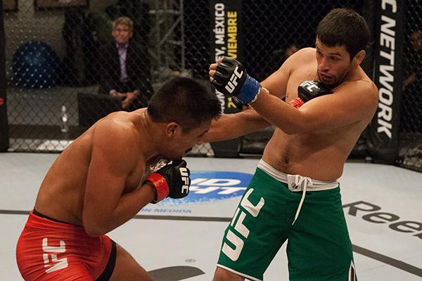 LAS VEGAS, NV - APRIL 7: (L-R) Enrique Barzola punches Jonathan Ortega during the filming of The Ultimate Fighter Latin America: Team Gastelum vs Team Escudero on April 7, 2015 in Las Vegas, Nevada. (Photo by Brandon Magnus/Zuffa LLC/Zuffa LLC via Getty