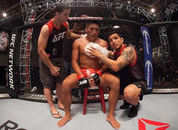 LAS VEGAS, NV - APRIL 7: Enrique Barzola receives advice from his corner while facing Jonathan Ortega during the filming of The Ultimate Fighter Latin America: Team Gastelum vs Team Escudero on April 7, 2015 in Las Vegas, Nevada. (Photo by Brandon Magnu