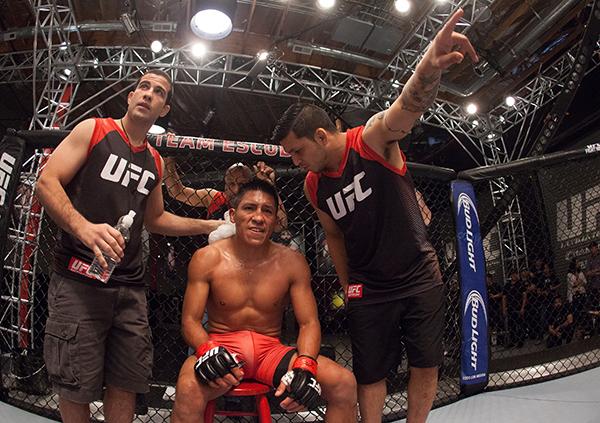LAS VEGAS, NV - APRIL 7: Enrique Barzola receives advice from his corner while facing Jonathan Ortega during the filming of The Ultimate Fighter Latin America: Team Gastelum vs Team Escudero on April 7, 2015 in Las Vegas, Nevada. (Photo by Brandon Magnu