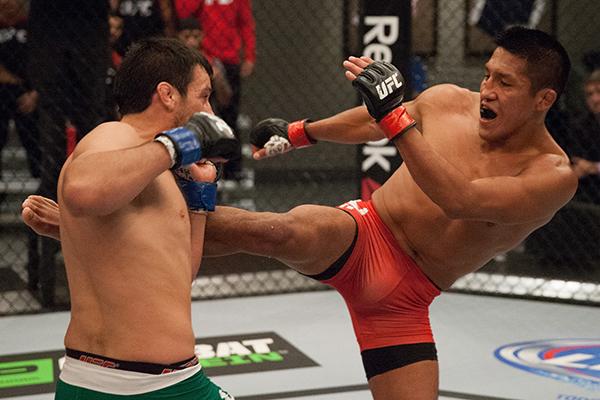 LAS VEGAS, NV - APRIL 7: (R-L) Enrique Barzola kicks Jonathan Ortega during the filming of The Ultimate Fighter Latin America: Team Gastelum vs Team Escudero on April 7, 2015 in Las Vegas, Nevada. (Photo by Brandon Magnus/Zuffa LLC/Zuffa LLC via Getty I
