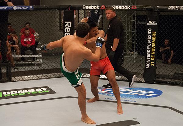 LAS VEGAS, NV - APRIL 7: (L-R) Jonathan Ortega kicks Enrique Barzola during the filming of The Ultimate Fighter Latin America: Team Gastelum vs Team Escudero on April 7, 2015 in Las Vegas, Nevada. (Photo by Brandon Magnus/Zuffa LLC/Zuffa LLC via Getty I