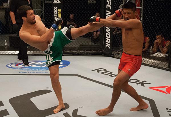 LAS VEGAS, NV - APRIL 7: (L-R) Jonathan Ortega kicks Enrique Barzola during the filming of The Ultimate Fighter Latin America: Team Gastelum vs Team Escudero on April 7, 2015 in Las Vegas, Nevada. (Photo by Brandon Magnus/Zuffa LLC/Zuffa LLC via Getty I