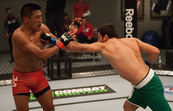 LAS VEGAS, NV - APRIL 7: (R-L) Jonathan Ortega punchesEnrique Barzola during the filming of The Ultimate Fighter Latin America: Team Gastelum vs Team Escudero on April 7, 2015 in Las Vegas, Nevada. (Photo by Brandon Magnus/Zuffa LLC/Zuffa LLC via Getty