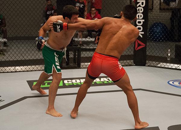 LAS VEGAS, NV - APRIL 7: (L-R) Jonathan Ortega punches Enrique Barzola during the filming of The Ultimate Fighter Latin America: Team Gastelum vs Team Escudero on April 7, 2015 in Las Vegas, Nevada. (Photo by Brandon Magnus/Zuffa LLC/Zuffa LLC via Getty