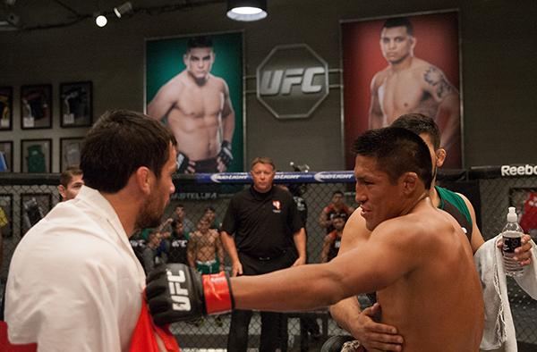 LAS VEGAS, NV - APRIL 7: (L-R) Enrique Barzola and Jonathan Ortega exchange words after thier fight during the filming of The Ultimate Fighter Latin America: Team Gastelum vs Team Escudero on April 7, 2015 in Las Vegas, Nevada. (Photo by Brandon Magnus/