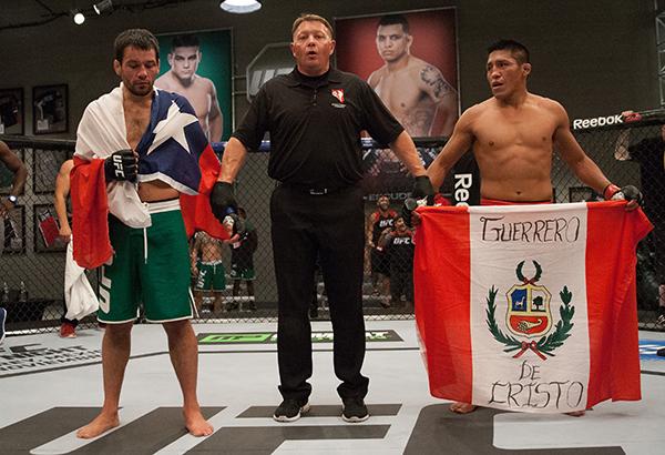 LAS VEGAS, NV - APRIL 7: (L-R) Jonathan Ortega and Enrique Barzola wait to hear the judges decision during the filming of The Ultimate Fighter Latin America: Team Gastelum vs Team Escudero on April 7, 2015 in Las Vegas, Nevada. (Photo by Brandon Magnus/