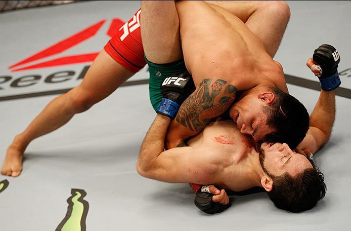 BUENOS AIRES, ARGENTINA - MAY 20:  (L-R) Pablo Sabori takes down Santiago Cardenas during the filming of The Ultimate Fighter Latin America: Team Liddell vs Team Griffin on May 20, 2016 in Buenos Aires, Argentina. (Photo by Gabriel Rossi/Zuffa LLC/Zuffa L