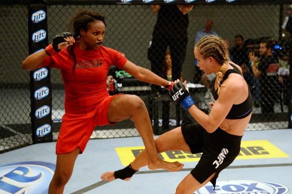 LAS VEGAS, NV - MAY 29:  Revelina Berto (L) kicks Jessica Rakoczy in their elimination fight during filming of season eighteen of The Ultimate Fighter on May 29, 2013 in Las Vegas, Nevada. (Photo by Al Powers/Zuffa LLC/Zuffa LLC via Getty Images) 